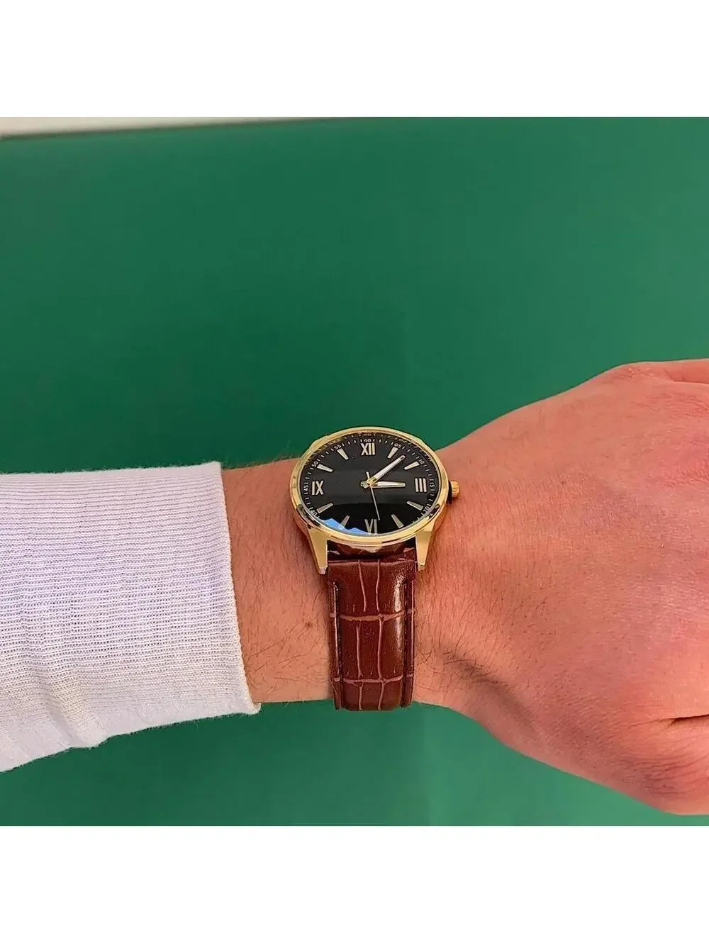 Minimalistic Black essential vintage style gold and leather style band watch. 9
